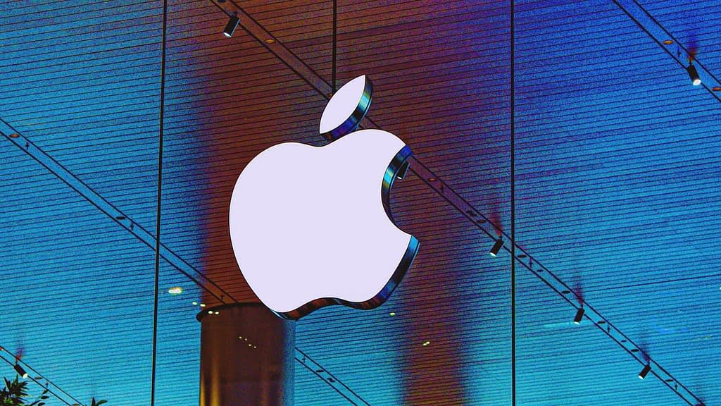 Apple-akcie-predikce Apple logo on a blue background.