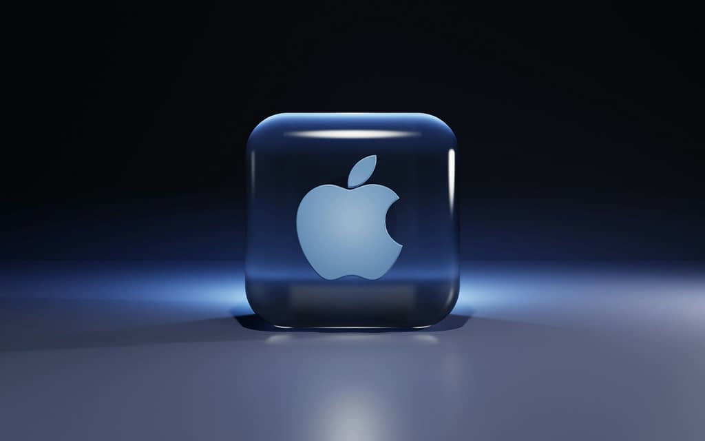 Apple Three-dimensional Apple logo in a futuristic style with blue backlight, symbolizing technological advancement and AI innovation.