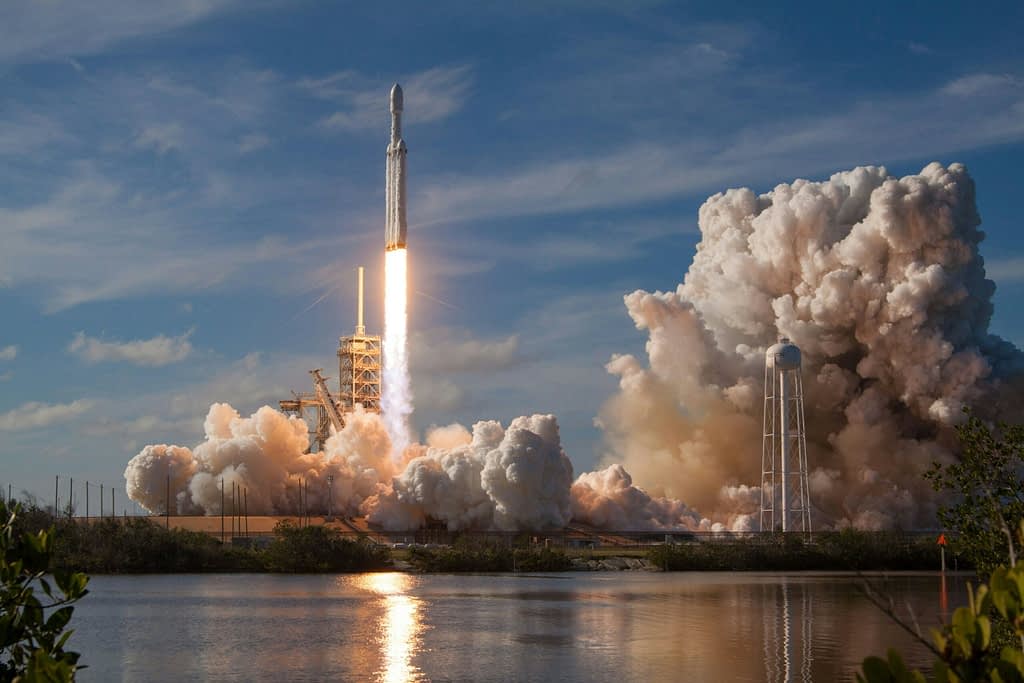SpaceX Falcon Heavy rocket launch from Kennedy Space Center - space technology investments like Voyager Technologies NYSE IPO debut