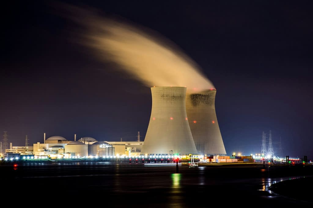 Nuclear power plant cooling towers at night with steam emission - Meta Constellation Energy clean energy deal for AI data centers