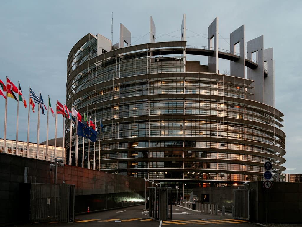 EU European Parliament building with EU member flags - symbol of US-Europe trade negotiations on tariffs